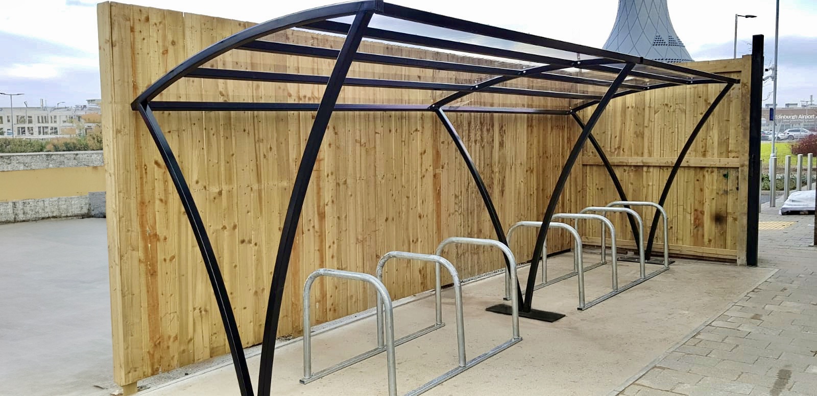 10 space Chelsea shelter with black RAL and toastrack cycle racks