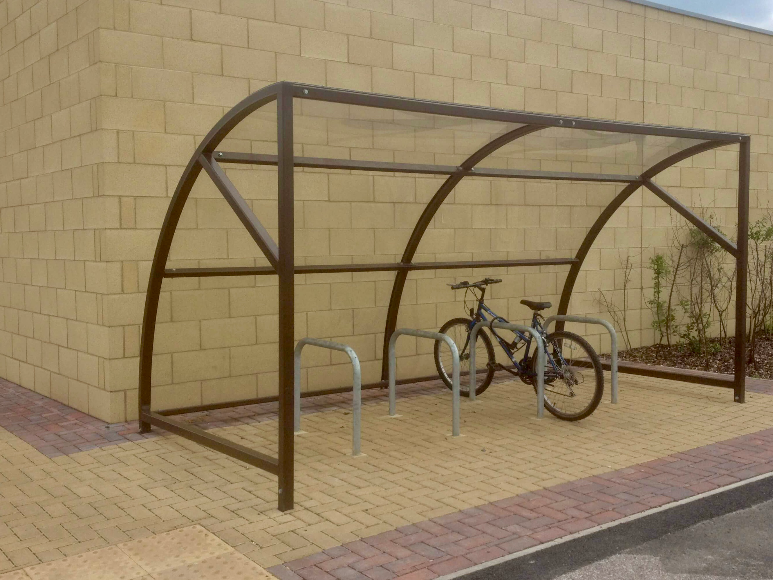 8 space original cycle shelter with galvanised Sheffield stands and bike secured