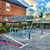 outdoor cycle shelter with steel and glass roof