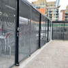 black galvanised 20 space Cambridge two-tier cycle shelter with high security anti-climb mesh partitioning