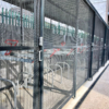 black galvanised 20 space Cambridge two-tier cycle shelter with high security anti-climb mesh partitioning