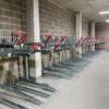 gas assisted two tier bike rack with red galvanised handles in commercial building