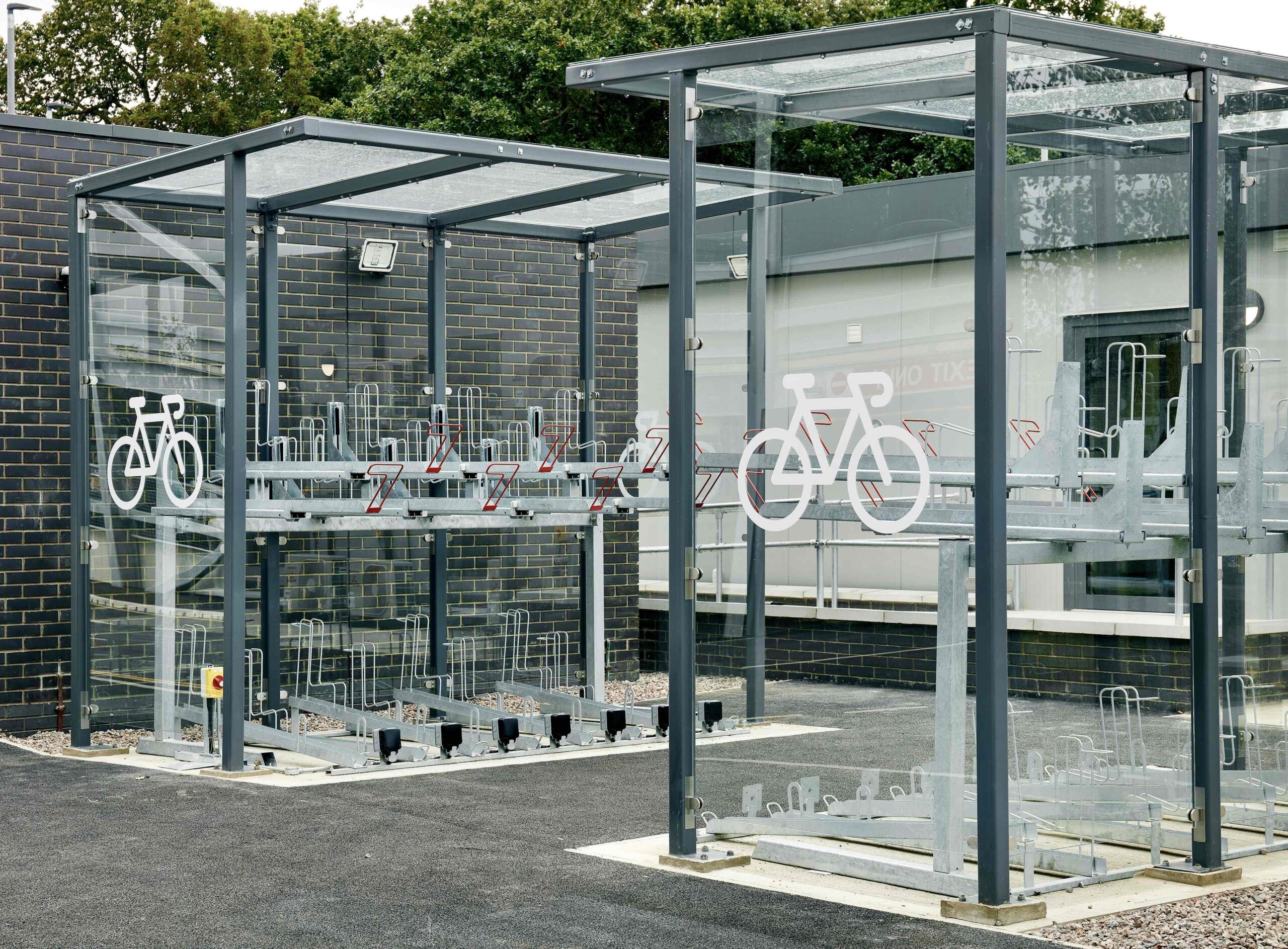 semi vertical gas assisted two tier bike rack with galvanised handles inside a bike shelter
