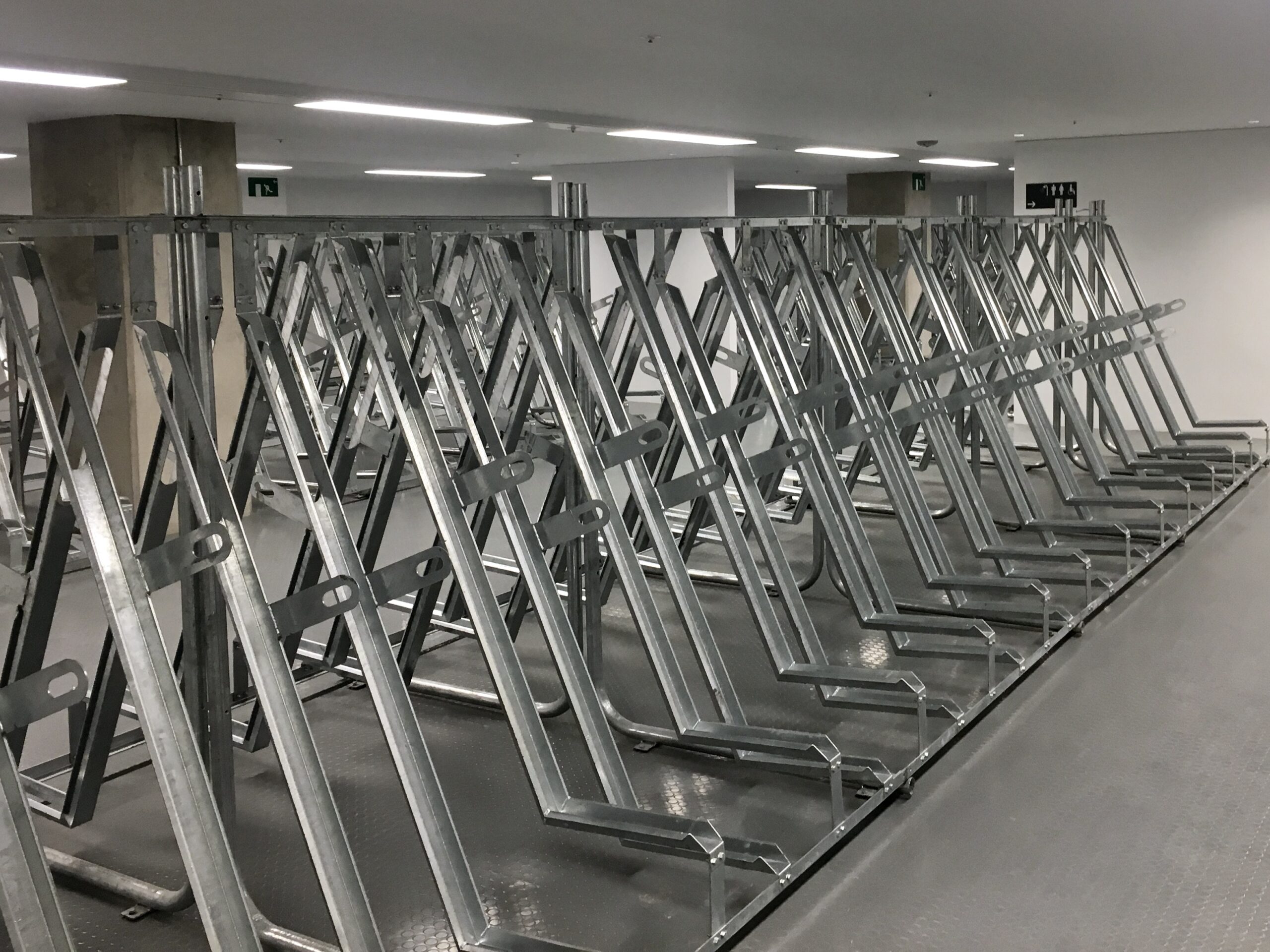 semi vertical cycle rack stored at commercial building indoors