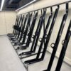 black galvanised steel semi vertical cycle racks stored indoors
