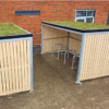 10 space Amazon eco cycle shelter with sedum roof and Sheffield galvanised cycle stand