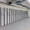 row of solo vertical bike racks stored in underground cycle storage