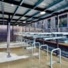 two tier cycle racks and bike stands installed within a bike shelter