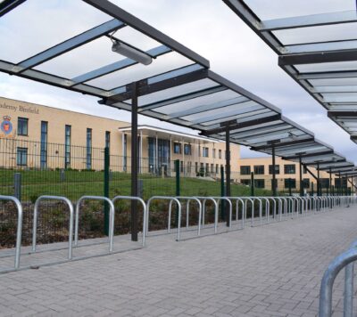 Long cantilevered cycle shelter in a school