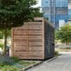 Side view of Premium Amazon Two Tier Cycle Shelter installed outside of the University of Birmingham