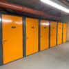 Individual tenant cycle store room in orange and grey
