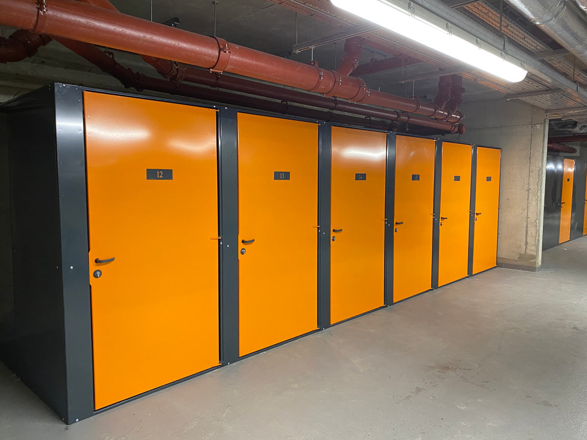 Individual tenant cycle store room in orange and grey