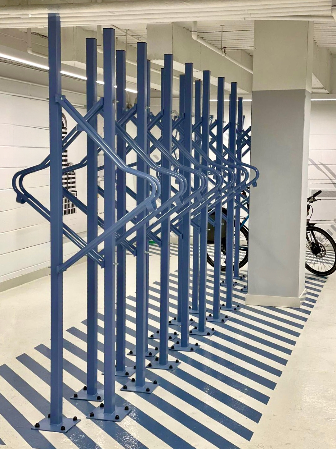 premium solo vertical bike rack in commercial building