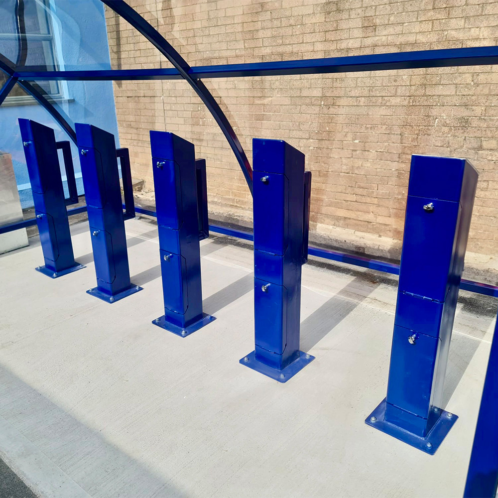 e-bike charging shelter with galvanised blue charging stands and frame