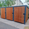 dark wooden cycle shelter with sheffield stands outside a property