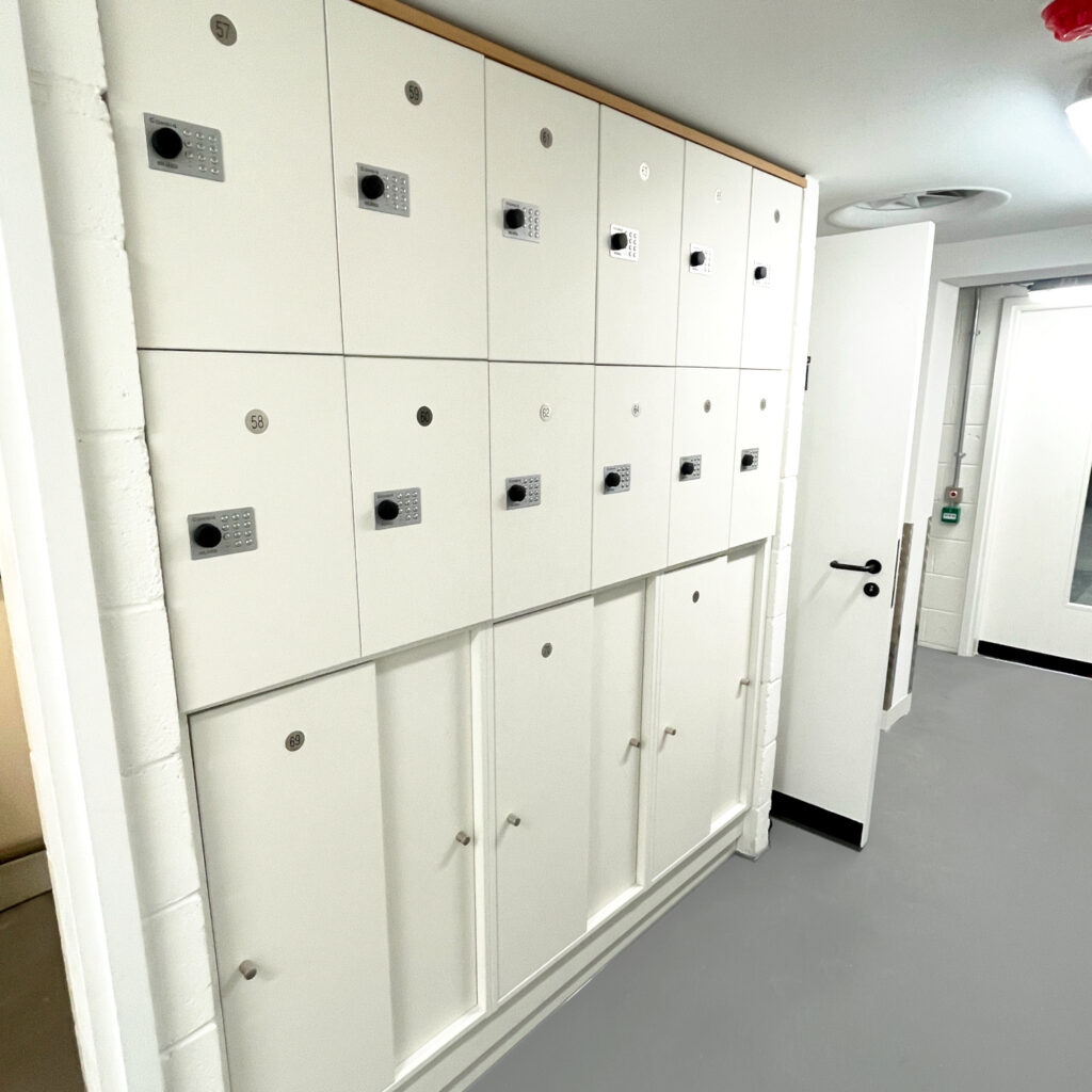 Accessible Clothing Lockers in white with lockers above
