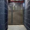 Perforated Mesh Fencing with swing door installed in an internal cycle storage facility