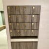 Islington Locker with wood panelling and gold accents installed in an end of trip cycle storage facility