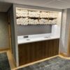 Towel station with towel bins in wooden finish