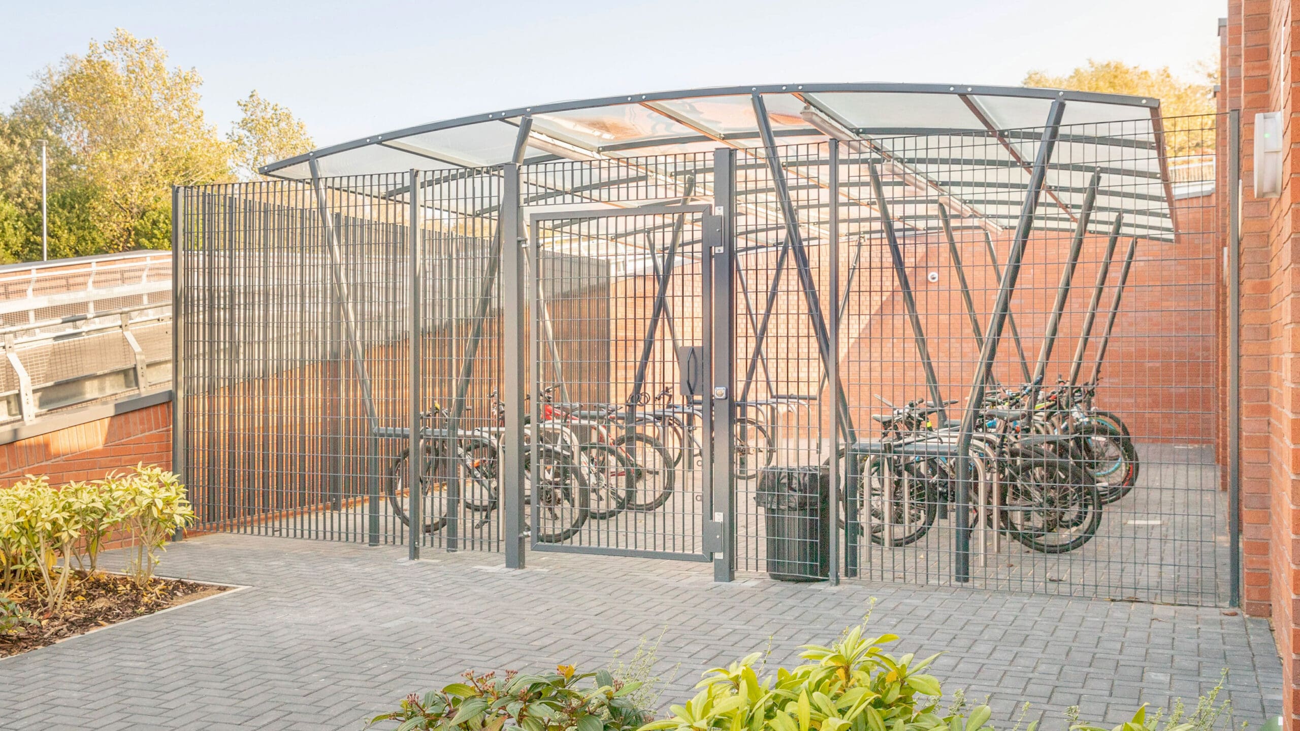 darlington shelter outside next to a brick with bikes locked on toastracks