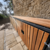 close up shot of wood cladding premium amazon eco cycle locker outside on a residential property
