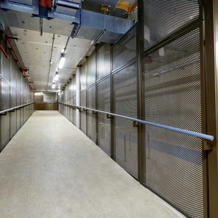 Perforated mesh fencing installed in an underground cycle storage facility