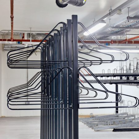 close up of solo vertical bike racks stored in underground cycle storage