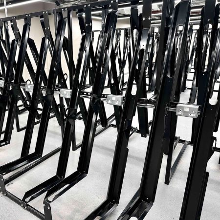 RAL Black Semi Vertical E-Bike Rack installed in underground cycle storage